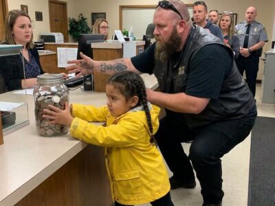 A 9-year-old brought $62 in coins to a bank to pay for her injured dad’s surgery. A biker overheard where her dad worked and called his entire club to the lobby.
