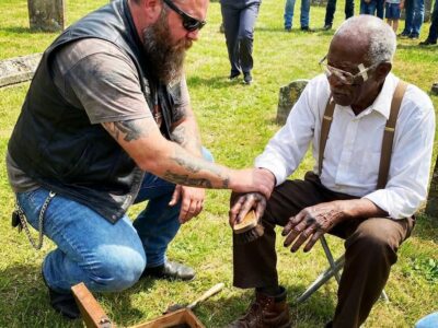 An old man fixed shoes for free every Sunday for 18 years. A biker walked into his shop and recognized the face in a dusty photo above the workbench.